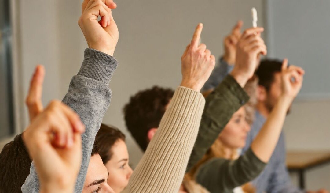 Restaurant job seekers raising their hands to share feedback about what they want from a job board
